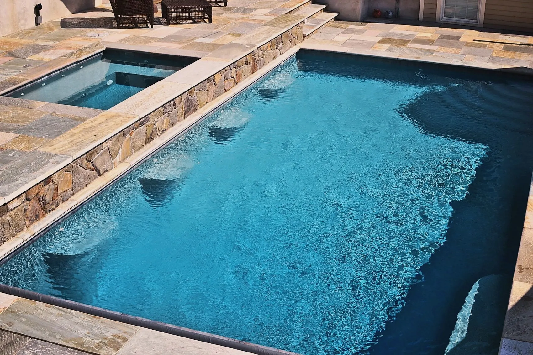 Rectilinear pool with raised spa